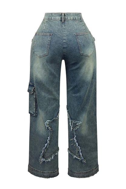 Woman wearing brown sheer corset top and distressed star-detail jeans