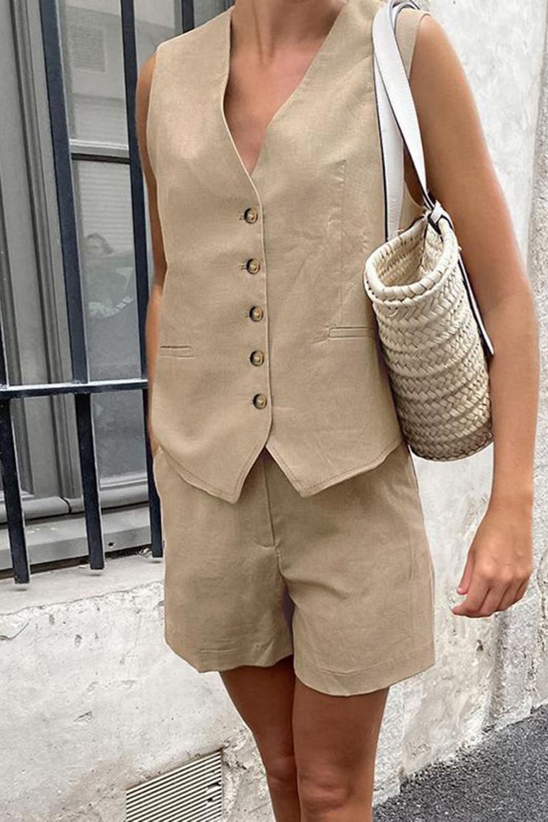Woman in white linen vest and shorts set