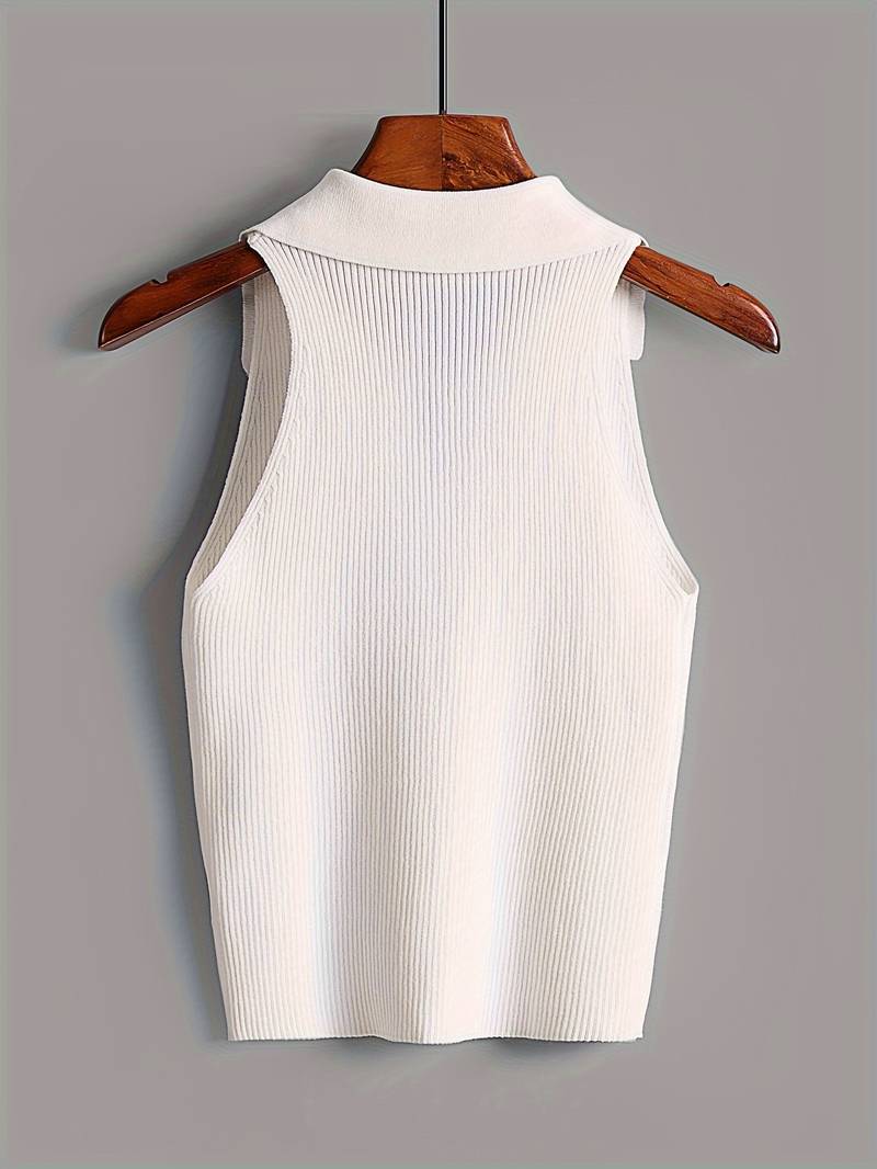 Woman in white ribbed halter top and denim shorts