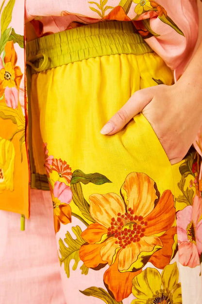 Woman in colorful floral linen pant set