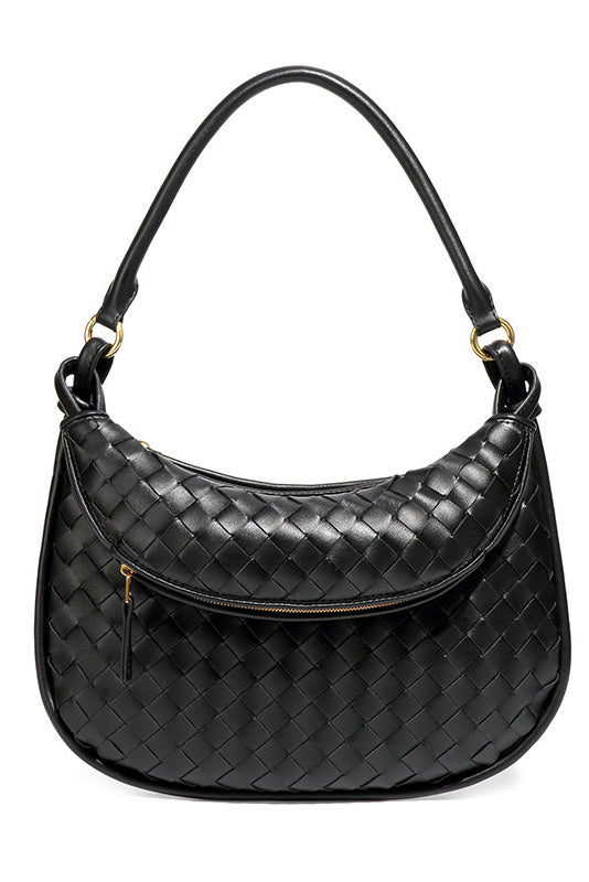 Woman holding dark brown woven leather hobo bag