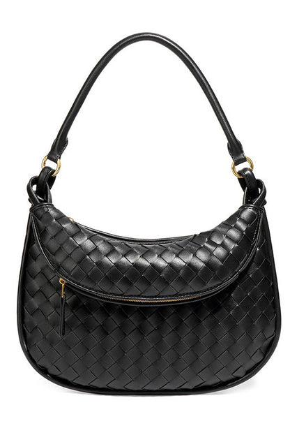 Woman holding dark brown woven leather hobo bag