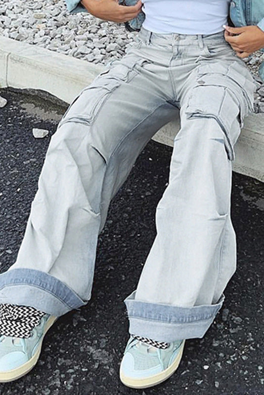 Light wash denim cargo pants with wide legs and multiple pockets.