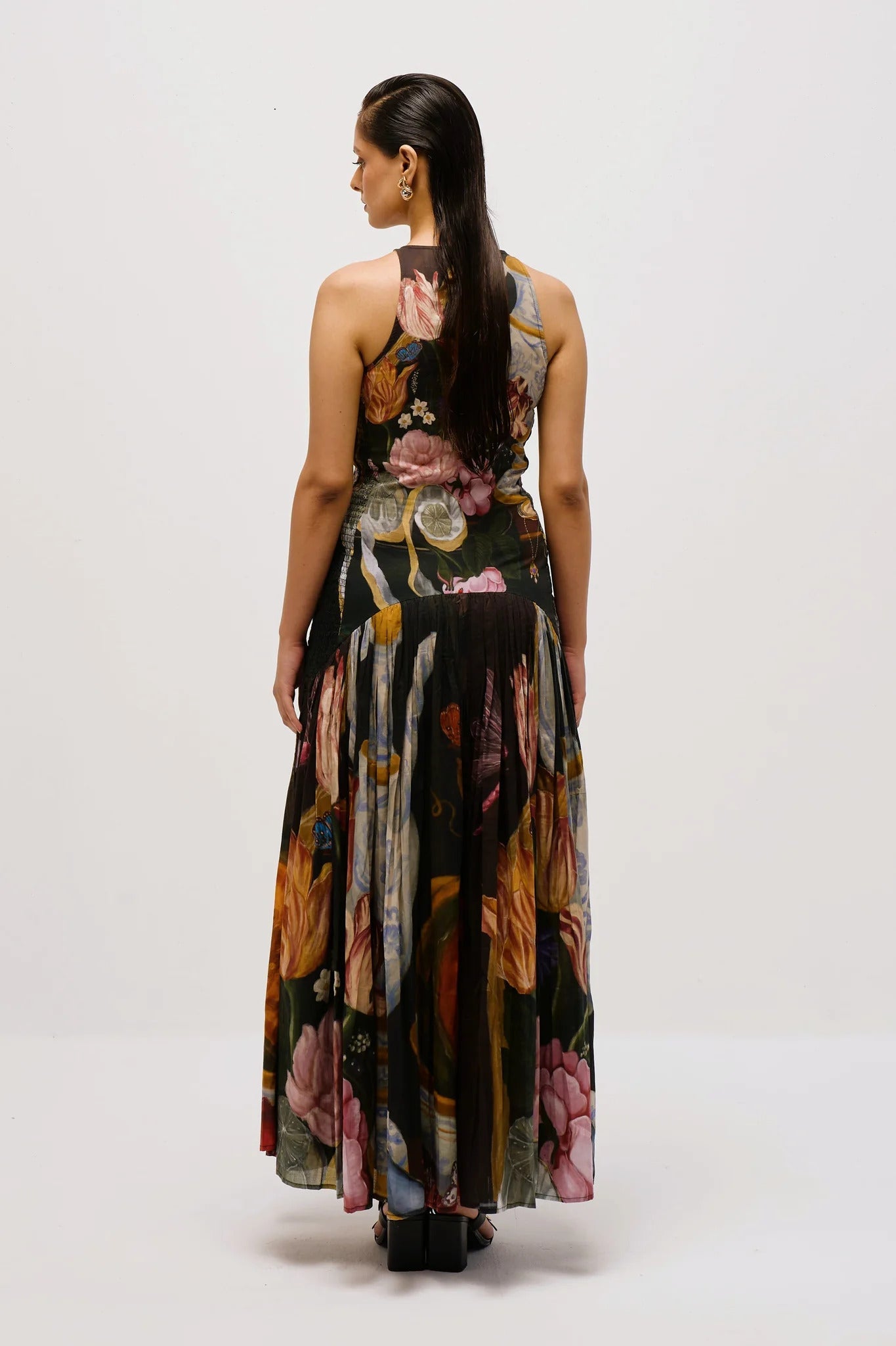 Woman in floral print chiffon maxi dress