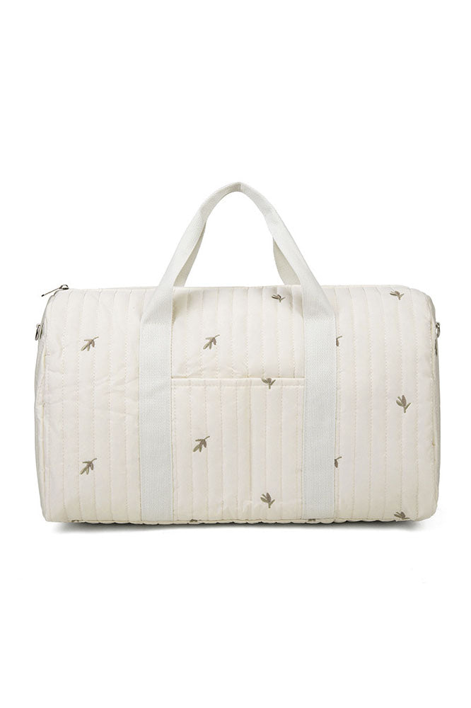 Off-white quilted duffle bag with teddy bear embroidery hanging on a coat rack