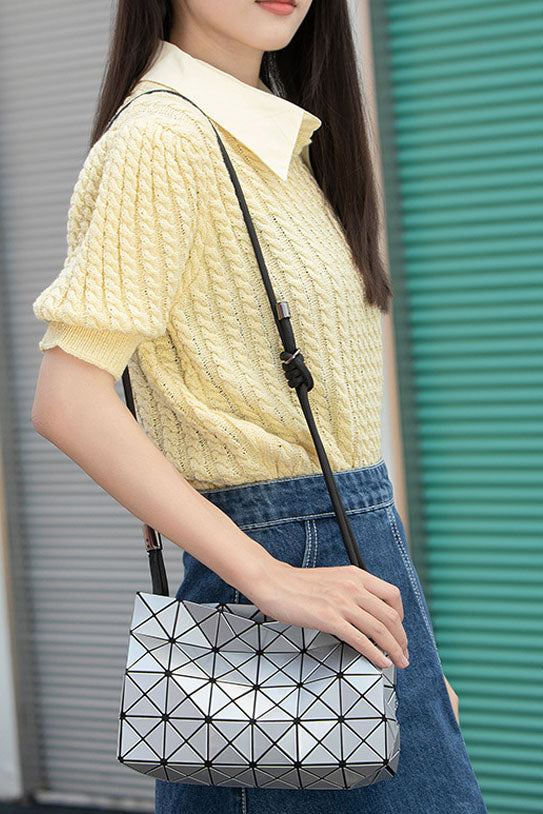 Ivory geometric shoulder bag with black strap