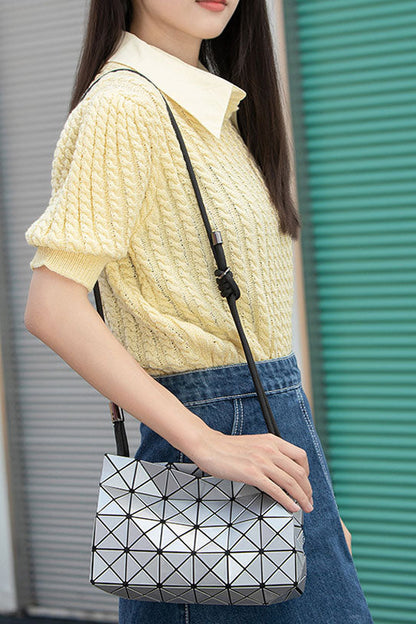 Ivory geometric shoulder bag with black strap