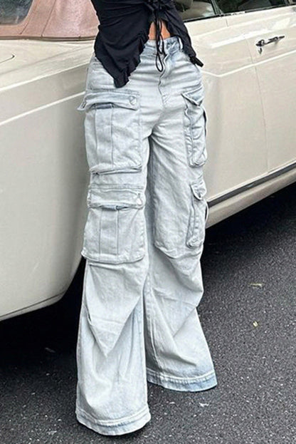 Light wash denim cargo pants with wide legs and multiple pockets.