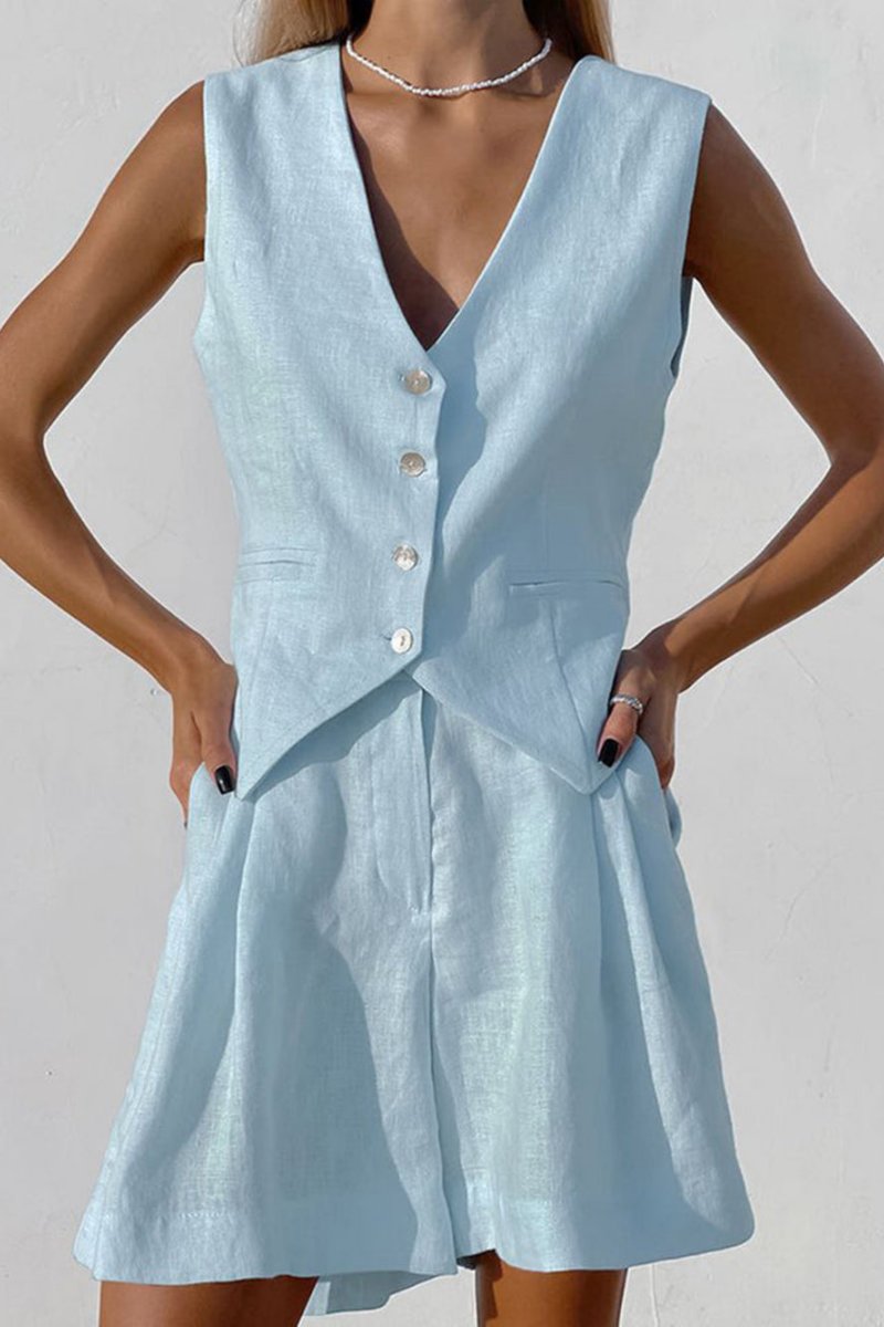 Woman in white linen vest and shorts set