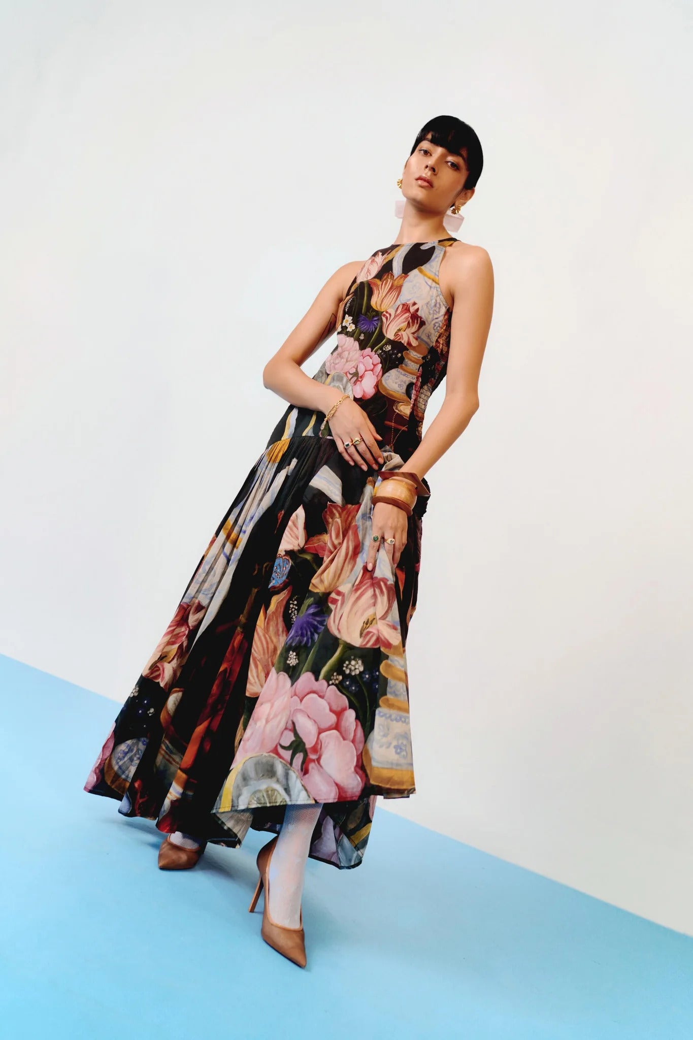 Woman in floral print chiffon maxi dress