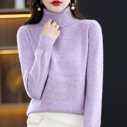 Woman wearing light blue cashmere turtleneck sweater