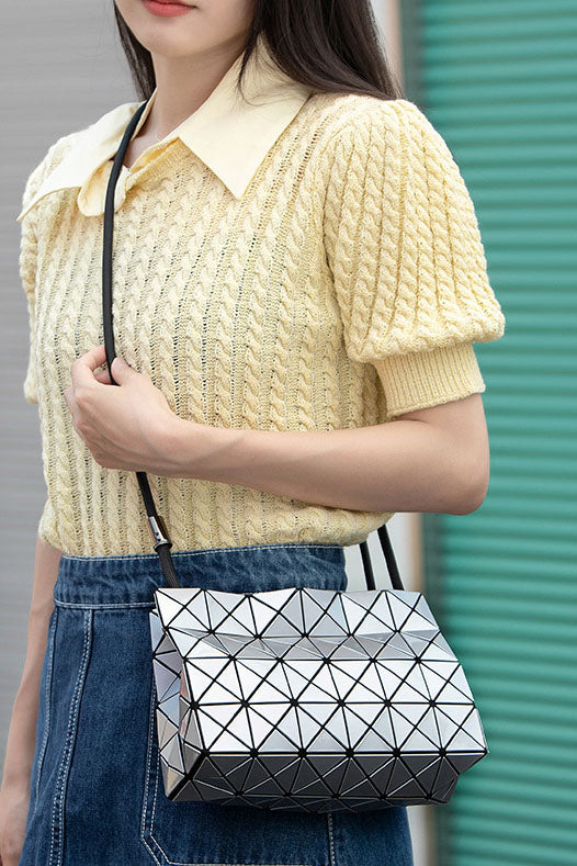 Ivory geometric shoulder bag with black strap