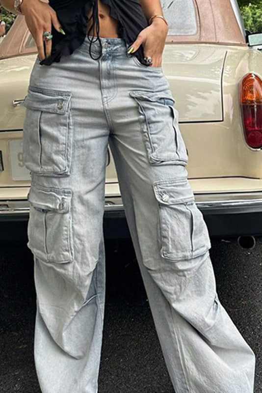 Light wash denim cargo pants with wide legs and multiple pockets.