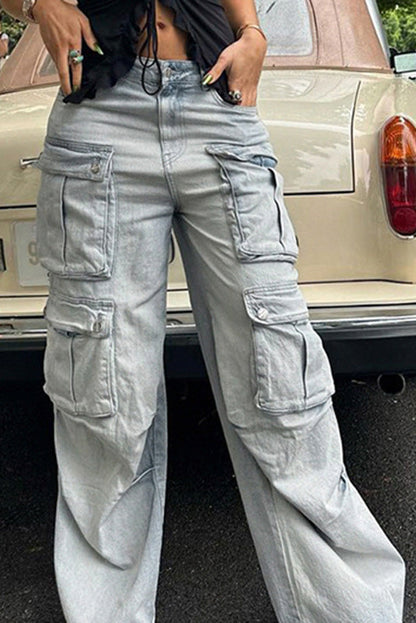 Light wash denim cargo pants with wide legs and multiple pockets.
