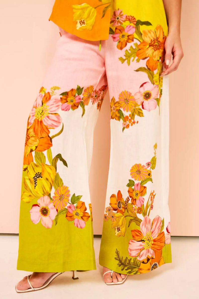 Woman in colorful floral linen pant set