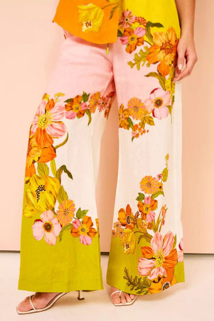 Woman in colorful floral linen pant set