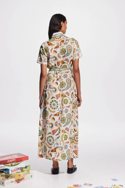 Woman in ivory paisley linen maxi dress with belt