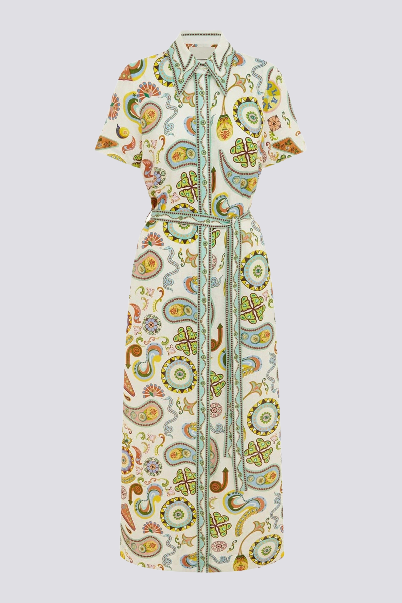 Woman in ivory paisley linen maxi dress with belt