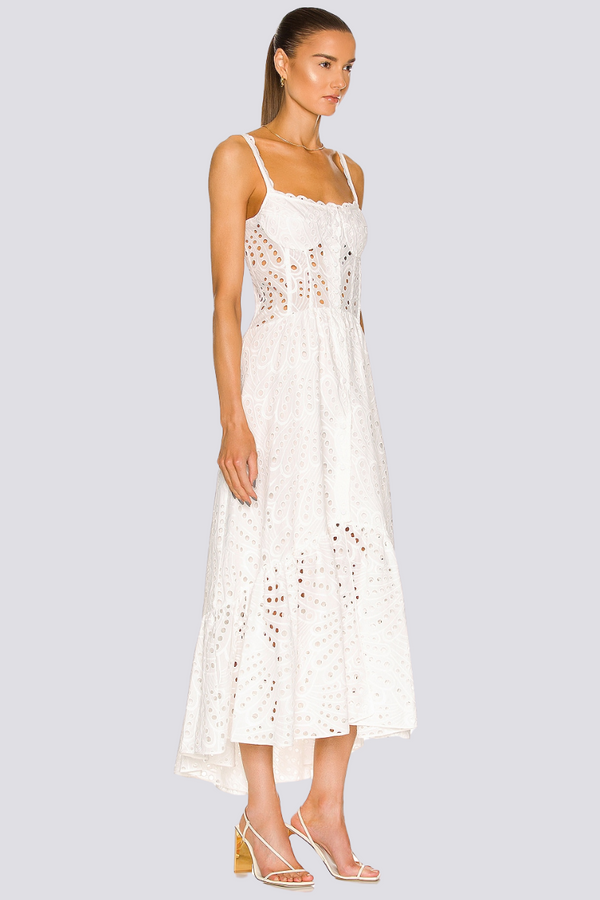 Woman wearing white eyelet embroidered midi dress