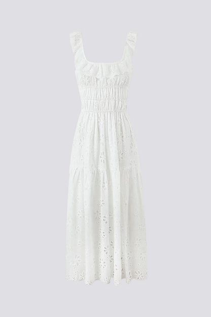 Woman in white eyelet maxi dress with ruffle sleeves