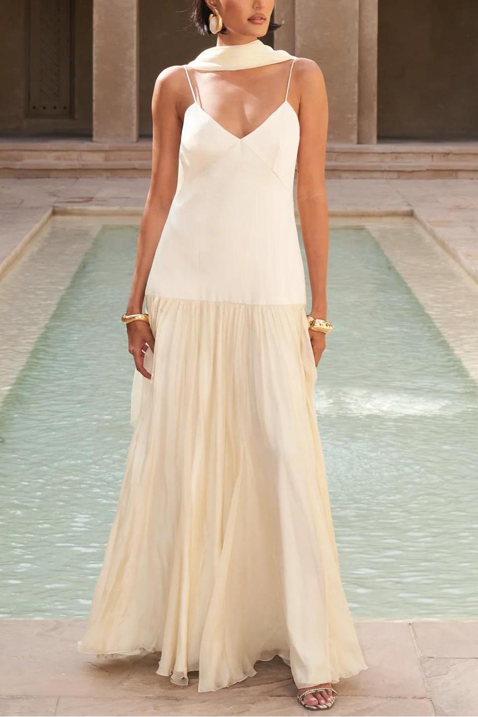 Woman in ivory chiffon maxi dress