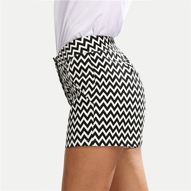 Close up of black and white diamond print woven shorts.