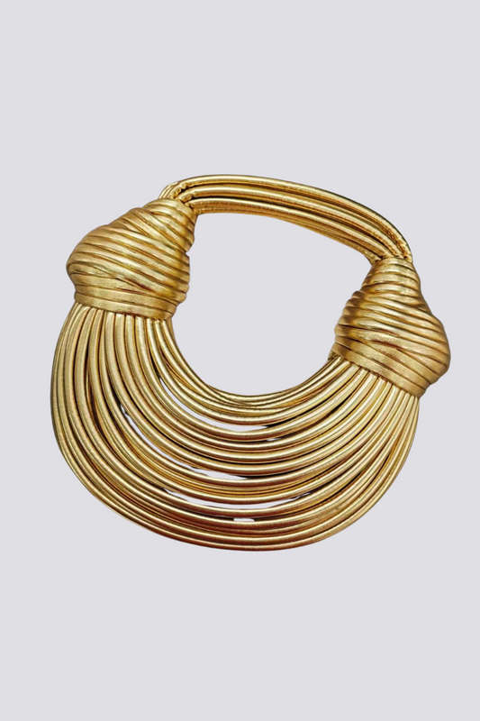 Gold rope handle bag with sculptural design