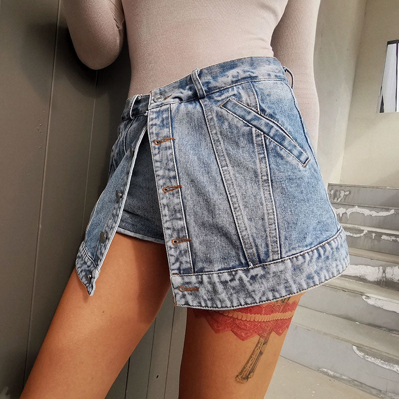 Woman wearing light wash denim skort with button detail