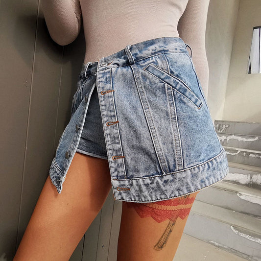 Woman wearing light wash denim skort with button detail