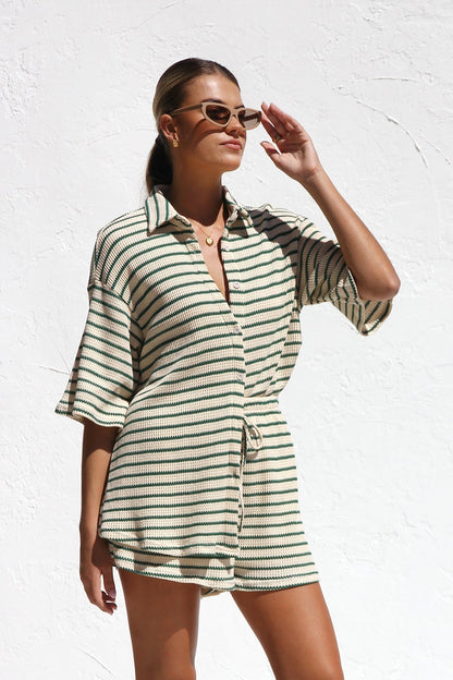 Woman in striped ribbed knit shirt and shorts set