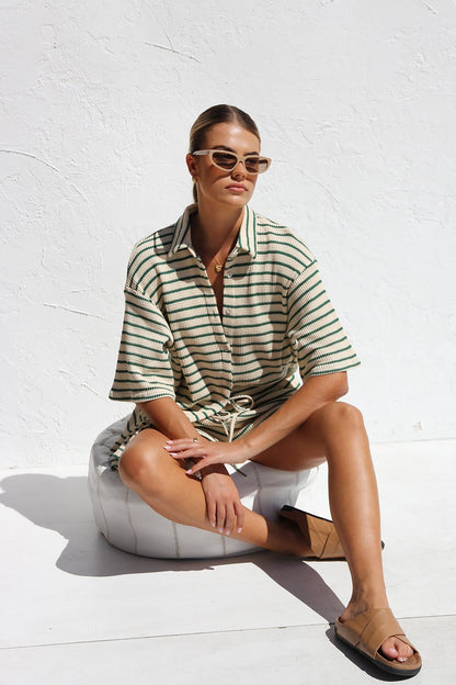 Woman in striped ribbed knit shirt and shorts set