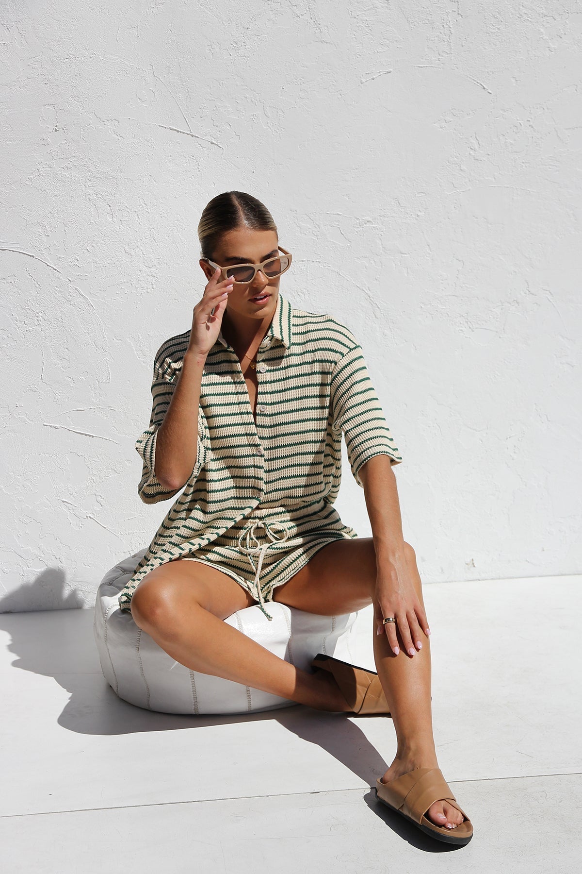 Woman in striped ribbed knit shirt and shorts set