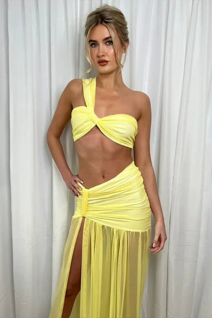 Woman in yellow sheer mesh two-piece set
