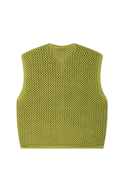 Woman wearing olive green crochet knit vest and denim shorts