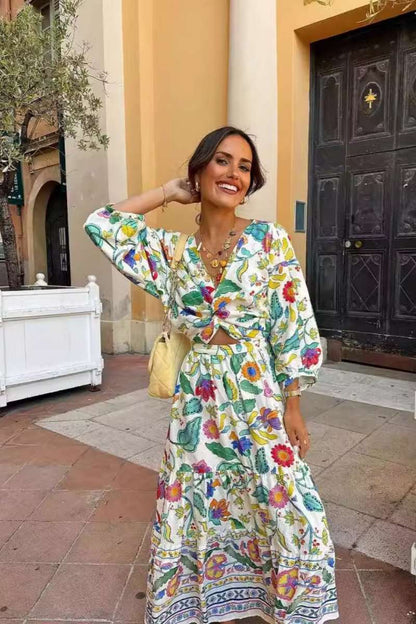 Woman wearing a floral print cotton maxi dress with a cutout waist.
