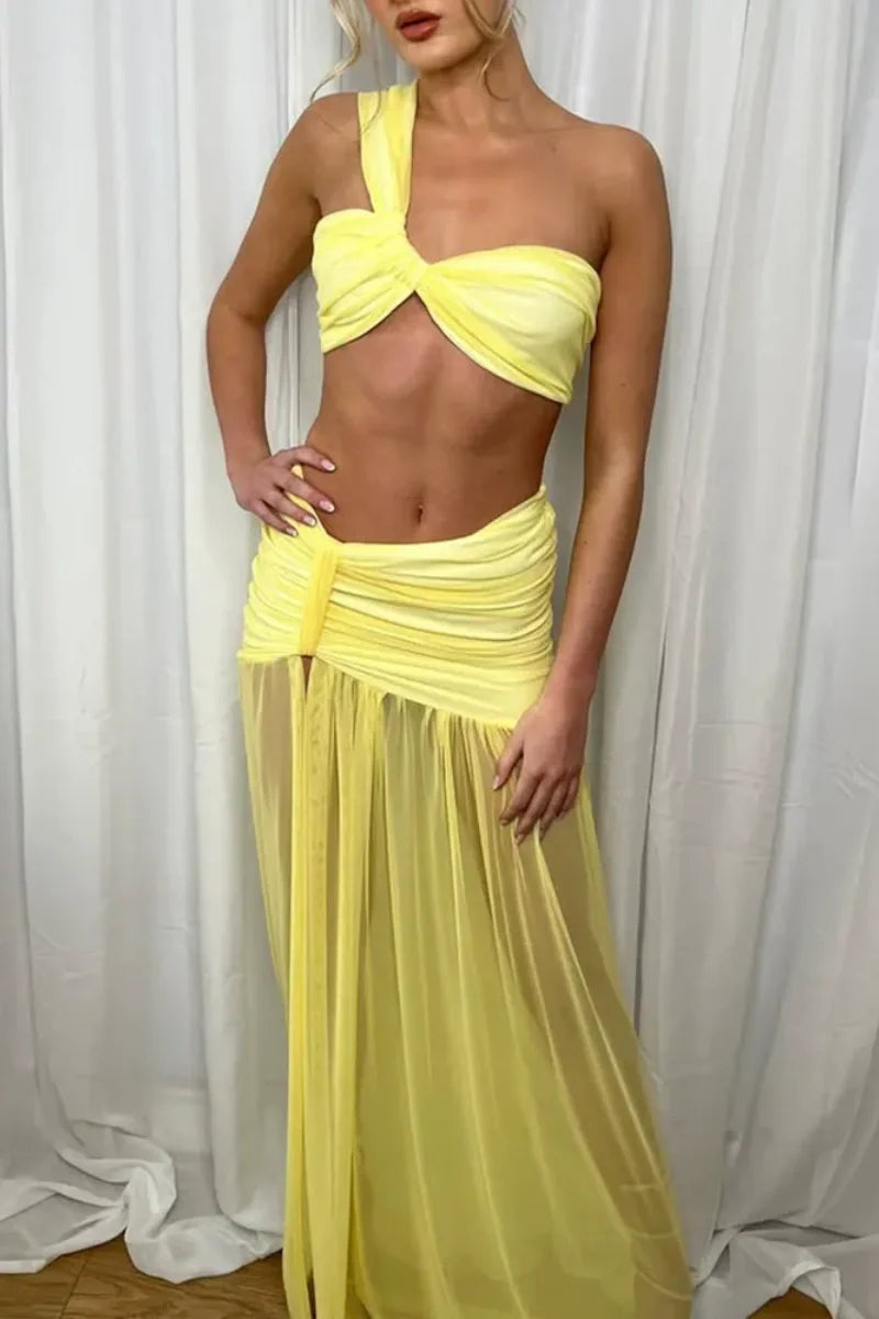 Woman in yellow sheer mesh two-piece set