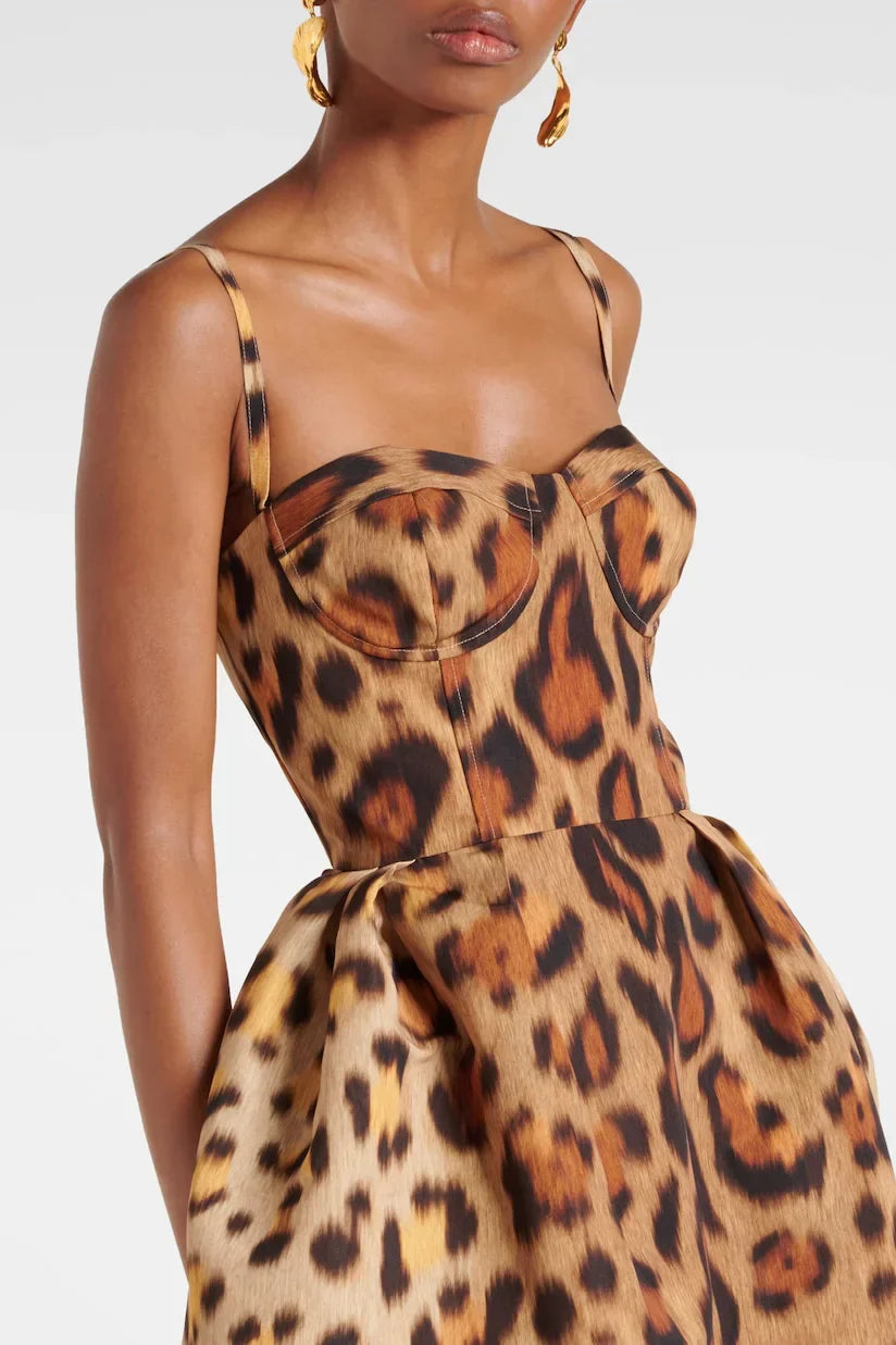 Woman wearing leopard print bustier midi dress