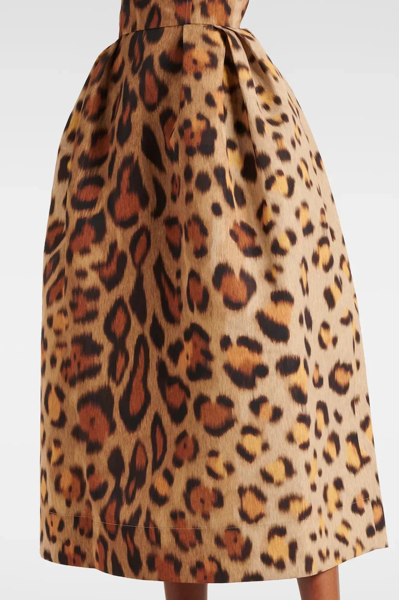 Woman wearing leopard print bustier midi dress