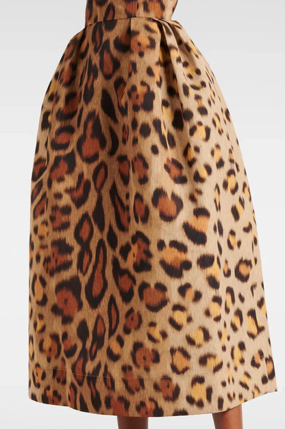 Woman wearing leopard print bustier midi dress