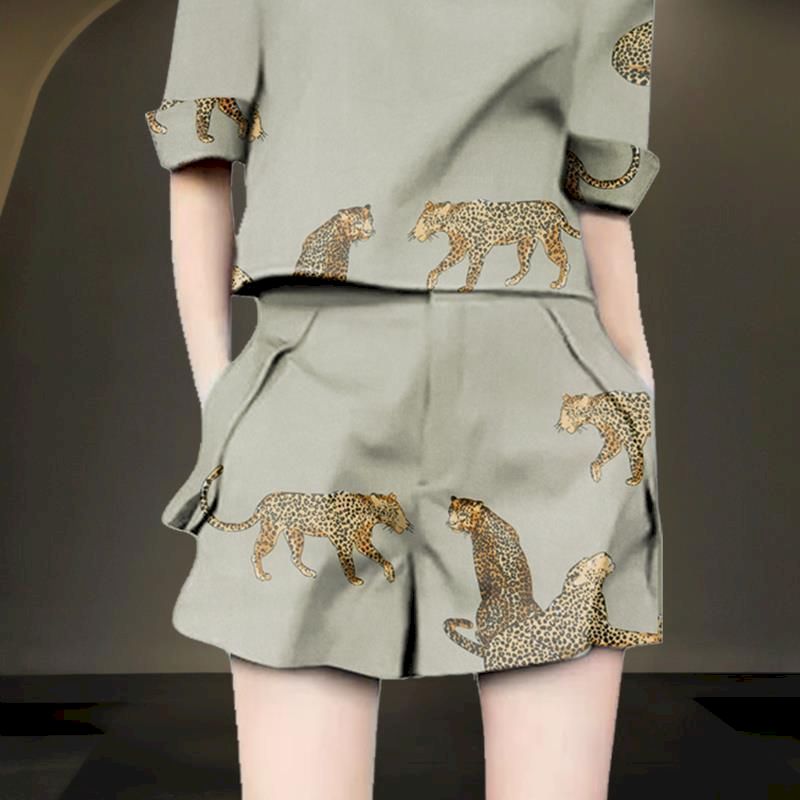 Woman wearing a sage green linen blend two-piece set with leopard print.