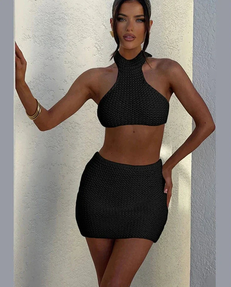 Woman wearing cream knit halter top and mini skirt set