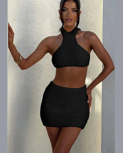 Woman wearing cream knit halter top and mini skirt set