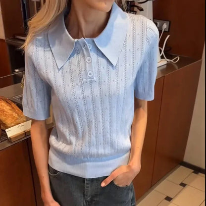 Woman wearing light pink pointelle knit polo shirt