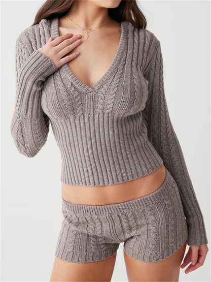 Woman wearing gray knit hoodie and shorts set