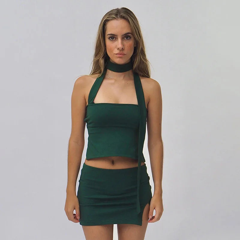 Woman in chocolate brown ribbed knit one-shoulder top and mini skirt.