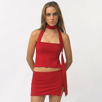 Woman in chocolate brown ribbed knit one-shoulder top and mini skirt.