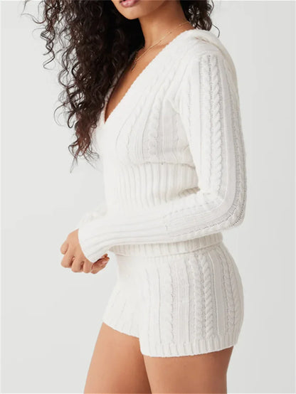 Woman wearing gray knit hoodie and shorts set