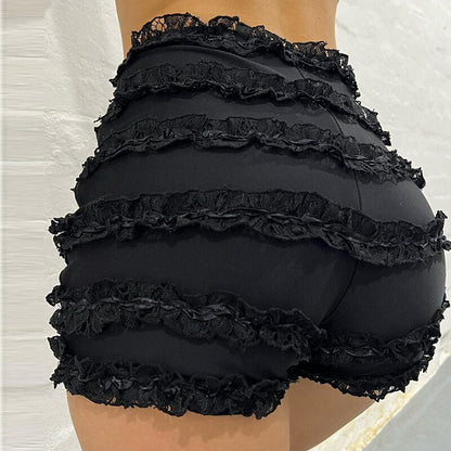 Woman wearing a white ruffle-tiered lace shorts