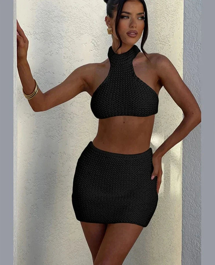 Woman wearing cream knit halter top and mini skirt set