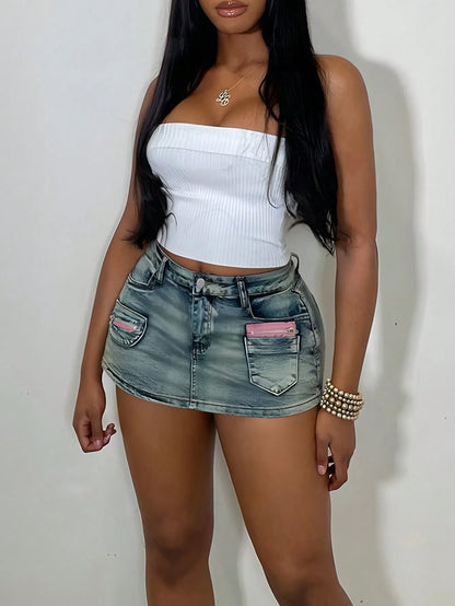 Woman wearing a denim mini skirt and white tube top